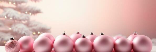 Soft pink Christmas banner background with soft pink Christmas tree decorations on a pink background photo