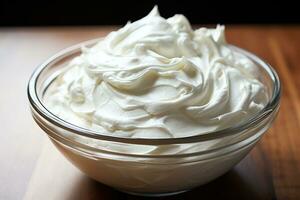 A bowl of whipped cream on a wooden background. Generated by artificial intelligence photo