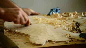 Luthier working on the top of a bowed instrument video