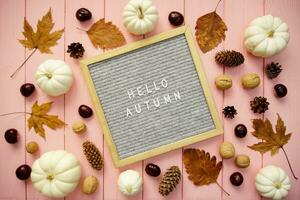 In the frame the inscription Hello autumn and autumn decor elements photo