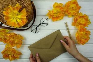 The woman's hand writes down her plans in a notebook photo