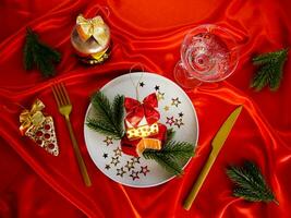 New Year's desserts. Creative table setting with Christmas tree toys. photo