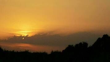 Sun setting in the mountains at sunset. Timelapse. video