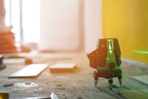 laser tile leveler for floor tiling installation in a room photo