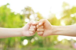 Children's hands with the warmth of mother's care photo