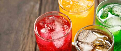 Soft drinks and fruit juice mixed with soda high in sugar have a negative effect on physical health photo