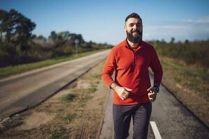 Adult man is jogging outdoor on sunny day. photo