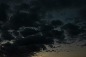 Stormy sky with dark clouds. Natural background. Sky background. Cloudscape, Colored Sunset. photo