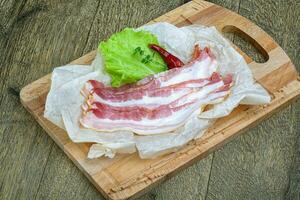 Raw sloced bacon photo