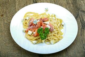 Pasta with salmon and cheese photo