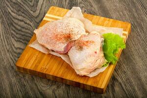 Raw chicken thigh photo