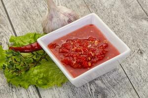 Spicy tomato and garlic sauce photo