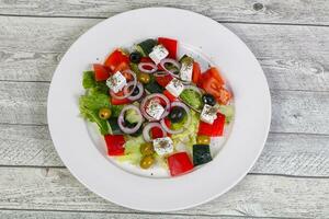 Traditional Greek salad with feta cheese photo