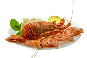 Spiny lobster, shrimps and rice photo