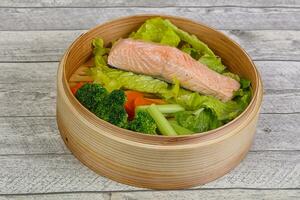 Steamed salmon with vegetables photo