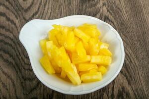 Canned pineapple in the bowl photo