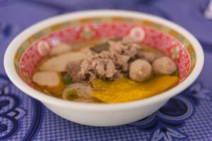 Thai soup in the bowl photo