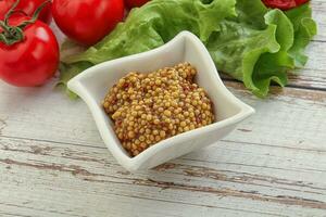 Mustard seeds sauce in the bowl photo