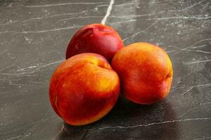 Ripe sweet juicy fresh red nectarines photo