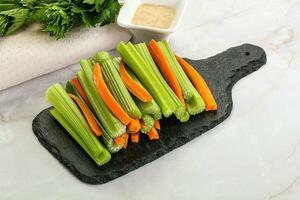 Vegan cuisine - dietary celery and carrot cticks photo