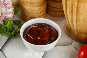 Tasty barbecue sauce in the bowl photo