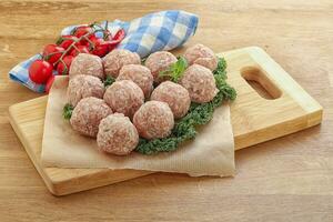 Raw pork meatball for cooking photo