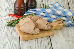 Baked pork tenderloin served rosemary photo