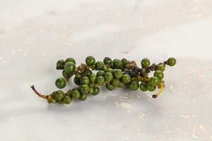 Green pepper corn heap isolated photo