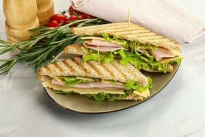 Homemade club sandwich with ham and cheese photo