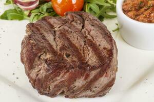 Grilled Beef Steak Isolated On a White Background photo