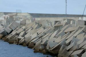 large chunks of concrete creating a harbour breakwater photo