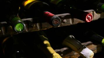 Tilt of bottles of wine and champagne in a cellar video