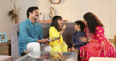 Video of Kids brother and sister celebrating Raksha Bandhan Festival Feeding Laddu