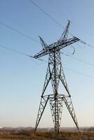 electricity pylon standing in country in Ukraine photo