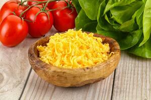 Shredded cheese in the bowl photo