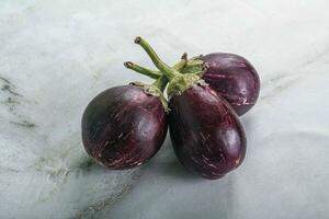 Raw smal asian baby eggplant photo