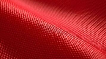 Red soccer fabric texture with air mesh. Sportswear background photo