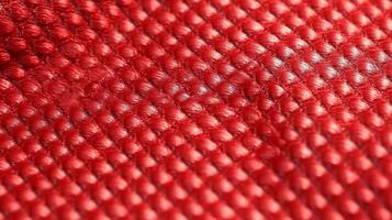 Red soccer fabric texture with air mesh. Athletic wear backdrop photo