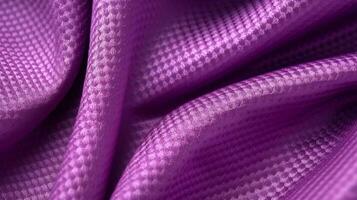 Purple soccer fabric texture with air mesh. Sportswear background photo