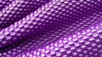 Purple soccer fabric texture with air mesh. Sportswear background photo