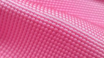 Pink soccer fabric texture with air mesh. Sportswear background photo