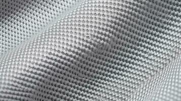 Grey soccer fabric texture with air mesh. Athletic wear backdrop photo