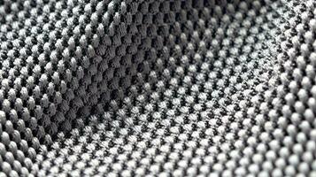 Grey soccer fabric texture with air mesh. Athletic wear backdrop photo