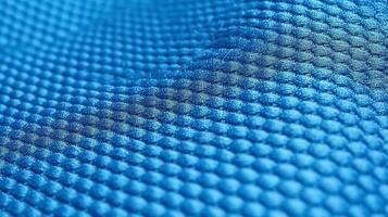 Blue soccer fabric texture with air mesh. Sportswear background photo