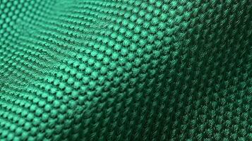 Green football shirt with air mesh texture. Sportswear background photo