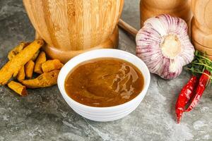 Indian curry sauce in the bowl photo