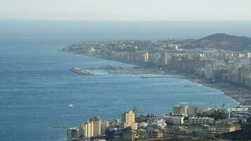 Overview of Malaga town of Fuengirola with the sea at sunset. video