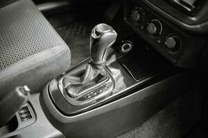 Car shift lever. Inside a modern car view, city car interior background photo