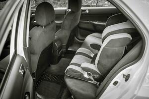 Child car chair inside the car. City car seat and interior photo