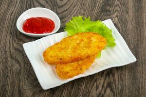 Potato pancake over wooden photo